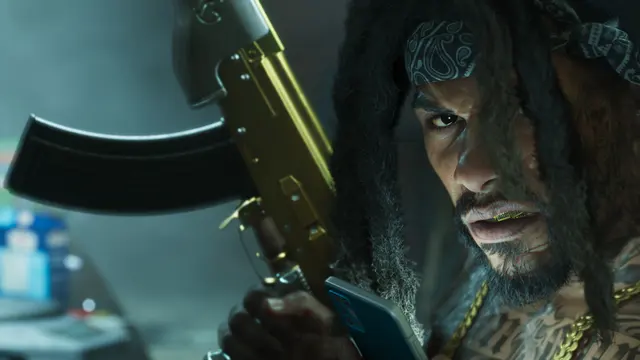 Homem de dreads segurando um fuzil dourado estilo AK, captura oficial do GTA 6