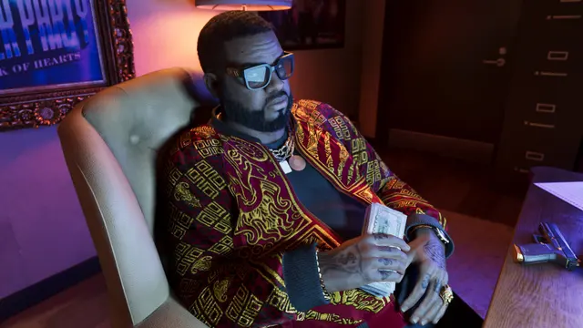 Boobie Ike sentado em seu escritório, em captura oficial do GTA 6