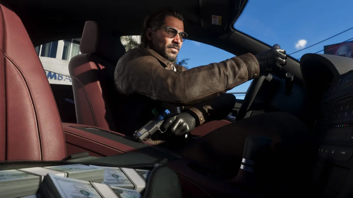 Personagem dirigindo com dinheiro e arma no banco, em imagem oficial do GTA 6